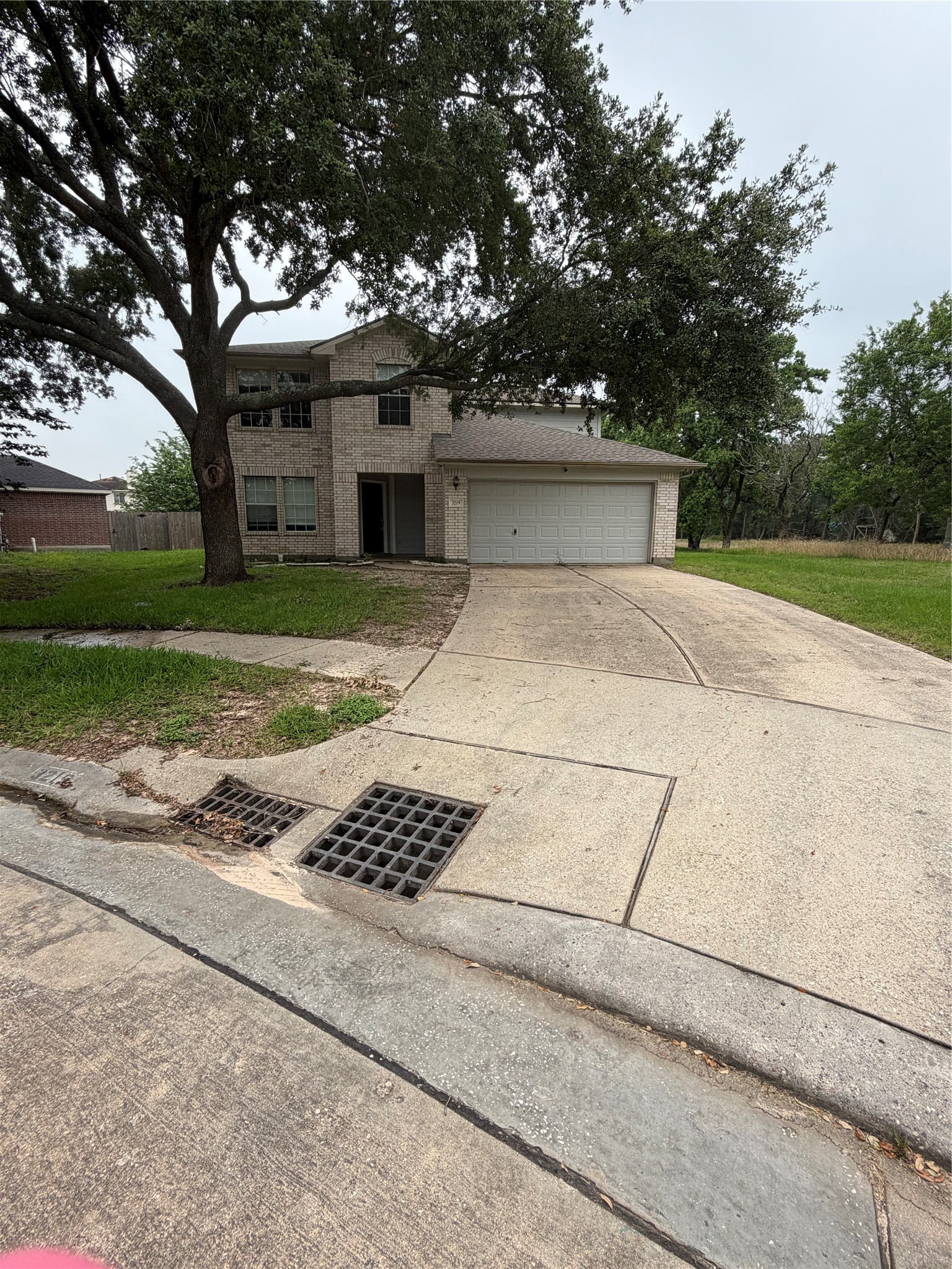 3219 Watercliff Court Spring, TX 77388 - Photo 2 of 21 a front view of a house with a yard and garage