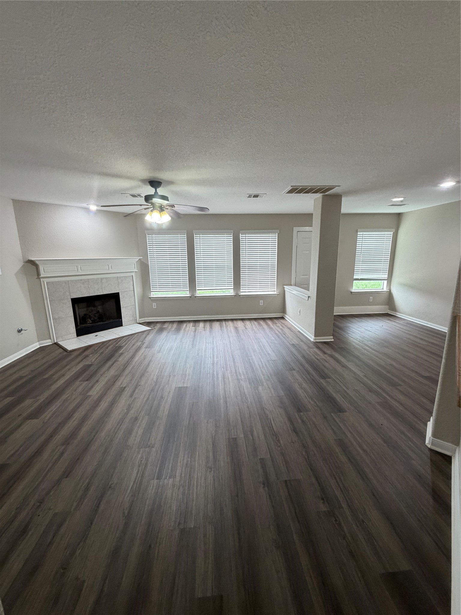 3219 Watercliff Court Spring, TX 77388 - Photo 5 of 21 wooden floor fireplace and windows in an empty room