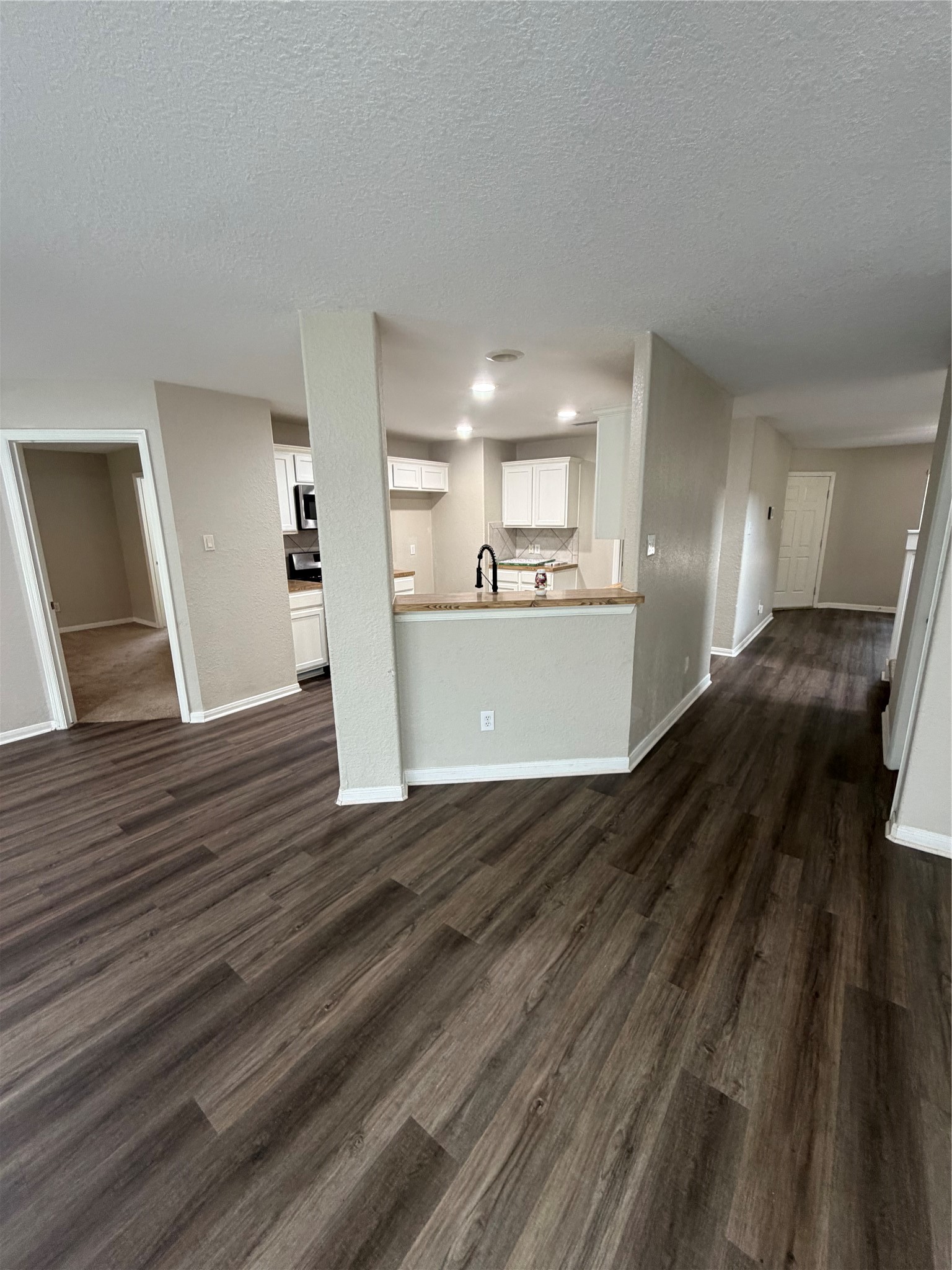 3219 Watercliff Court Spring, TX 77388 - Photo 6 of 21 a view of a kitchen counter space and wooden floor