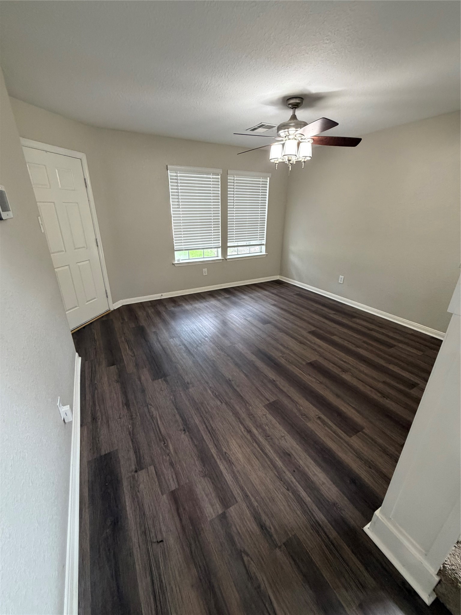 3219 Watercliff Court Spring, TX 77388 - Photo 10 of 21 wooden floor in an empty room with a window