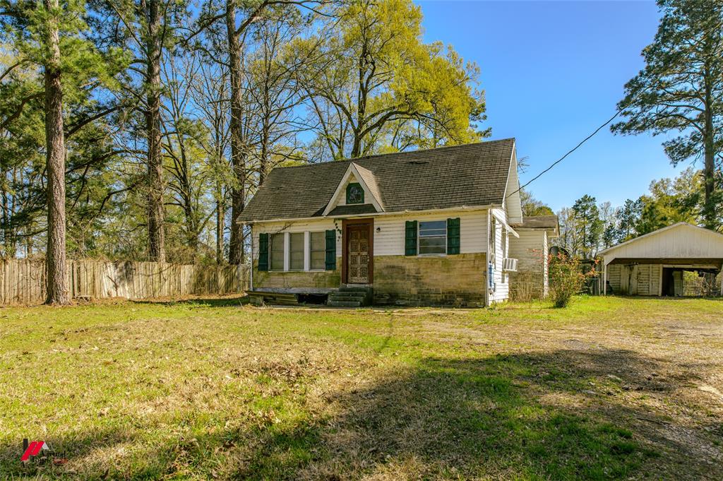 179 Daniel Thomas Road Springhill, LA 71075 - Photo 29 of 37 View of front of home with fence, a front lawn, and entry steps