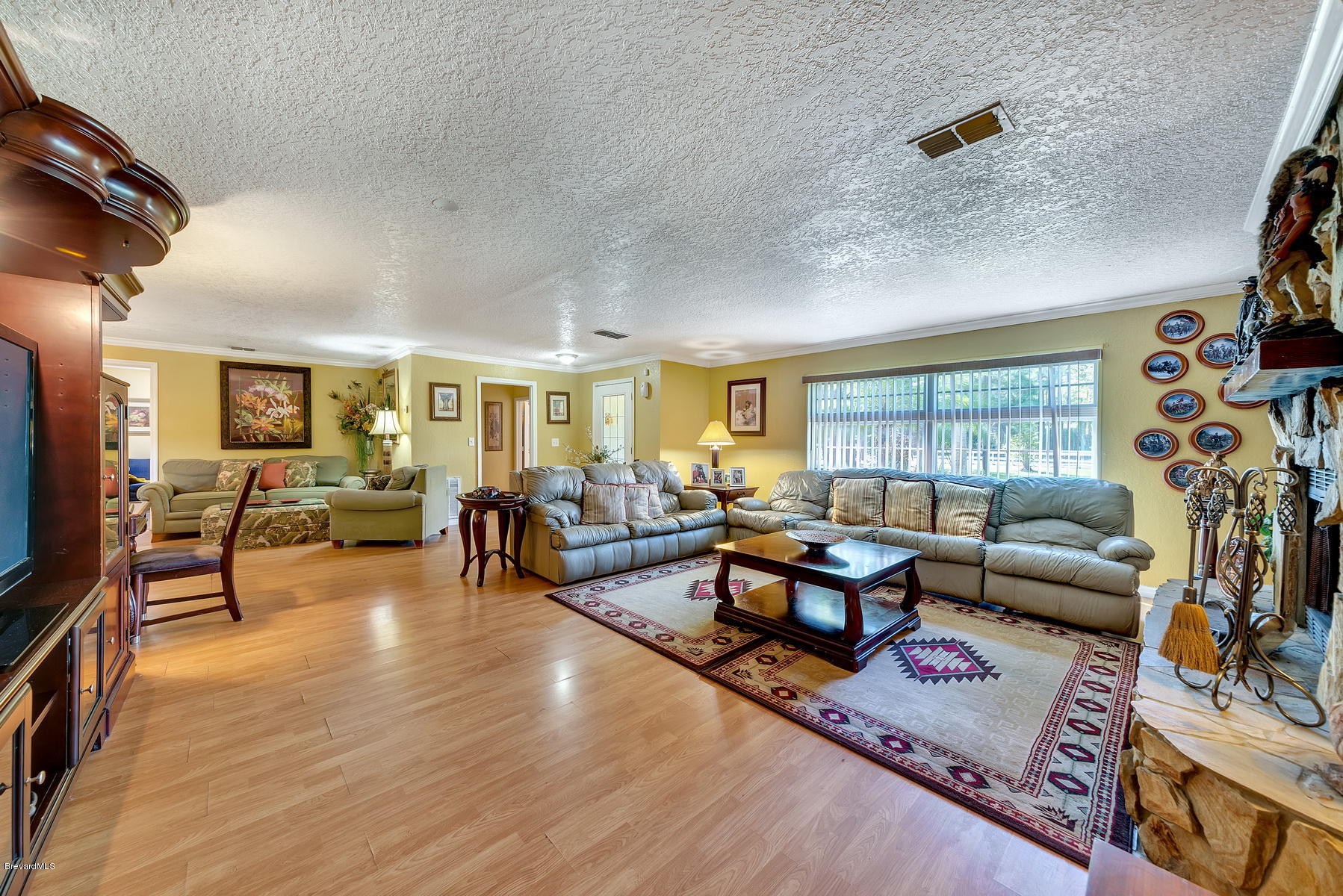3875 Burton Road Grant Valkaria, FL 32950 - Photo 11 of 44 Living Room with Wood Laminate Floors