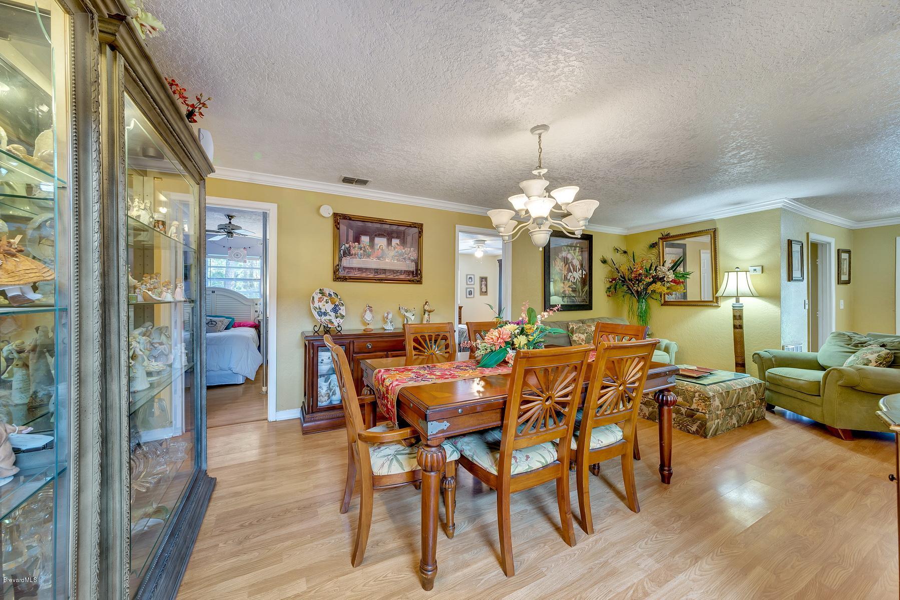 3875 Burton Road Grant Valkaria, FL 32950 - Photo 15 of 44 Dining Room with Sitting Area
