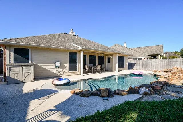 a front view of house with yard and outdoor seating