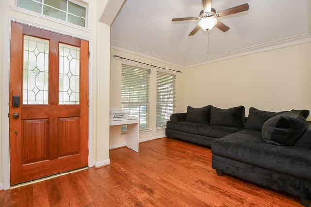 a living room with furniture and a window