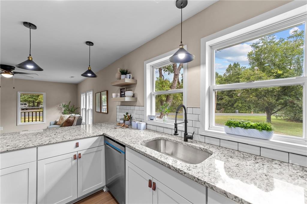 1025 Stone Road Salisbury, NC 28146 - Photo 11 of 47 a kitchen with granite countertop a sink and window