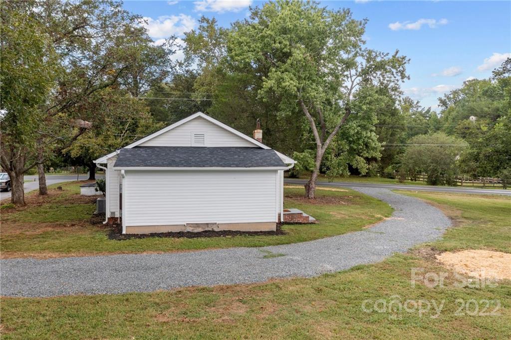 1025 Stone Road Salisbury, NC 28146 - Photo 39 of 47 a front view of a house with a yard and garage