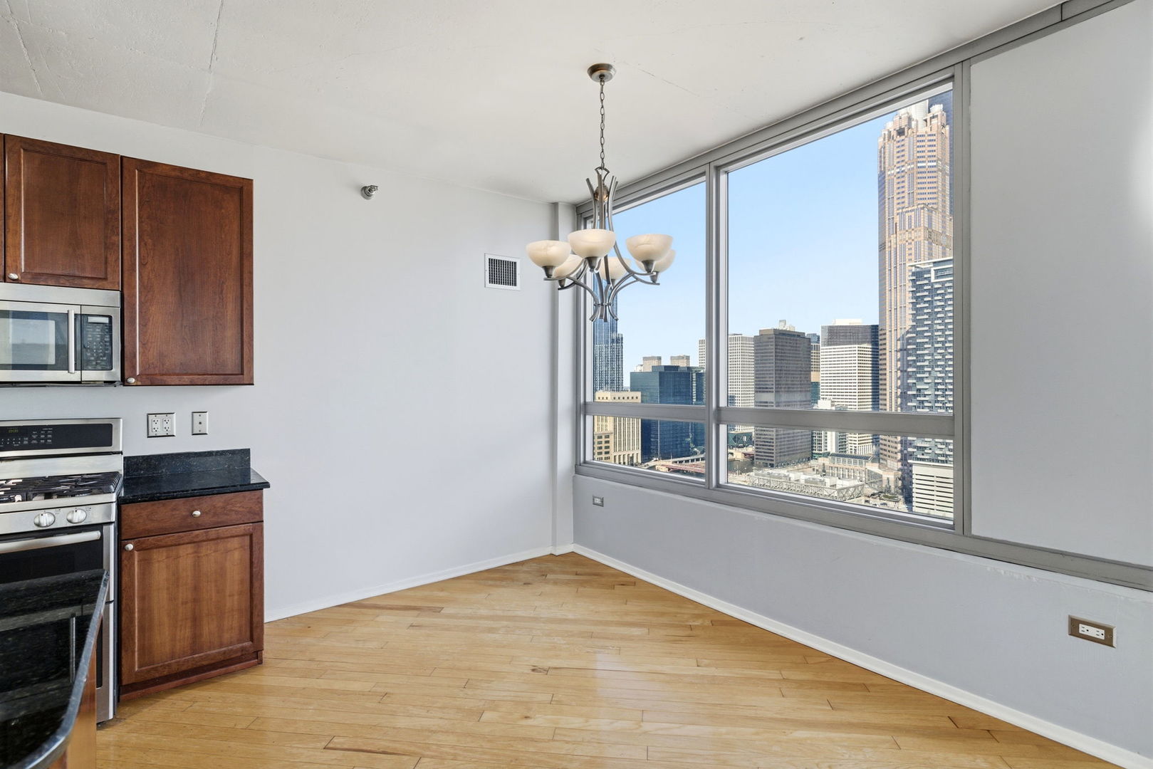 701 South Wells Street, Unit 2801 Chicago, IL 60607 - Photo 12 of 32 a view of a living room with a large window
