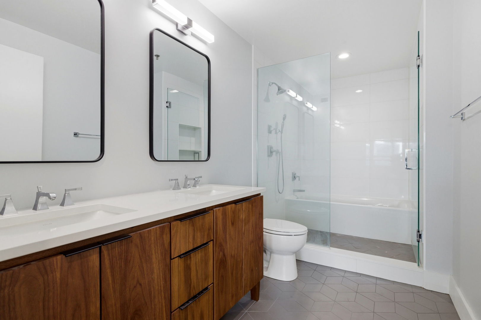 701 South Wells Street, Unit 2801 Chicago, IL 60607 - Photo 17 of 32 a bathroom with a double vanity sink mirror double and toilet