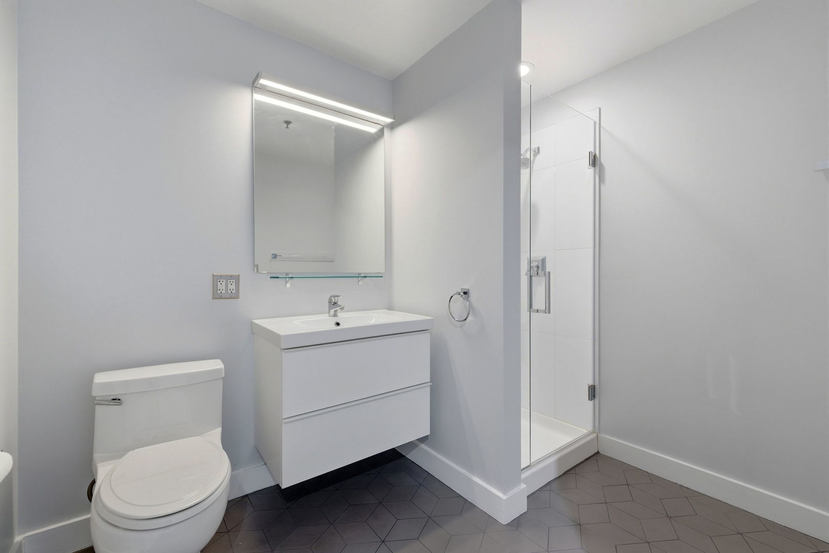 701 South Wells Street, Unit 2801 Chicago, IL 60607 - Photo 21 of 32 a bathroom with a toilet sink and mirror
