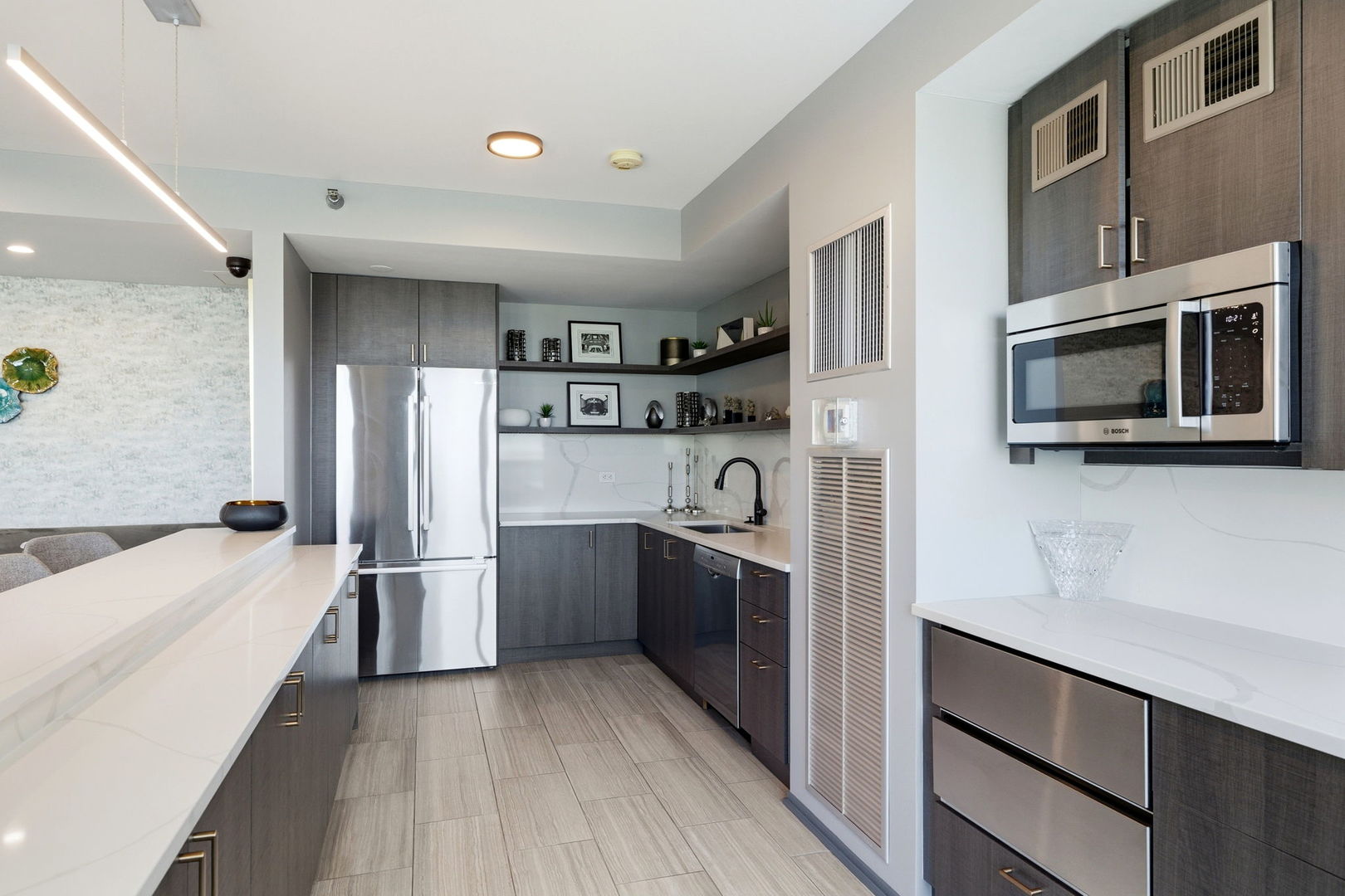 701 South Wells Street, Unit 2801 Chicago, IL 60607 - Photo 26 of 32 a kitchen with stainless steel appliances a refrigerator sink and microwave