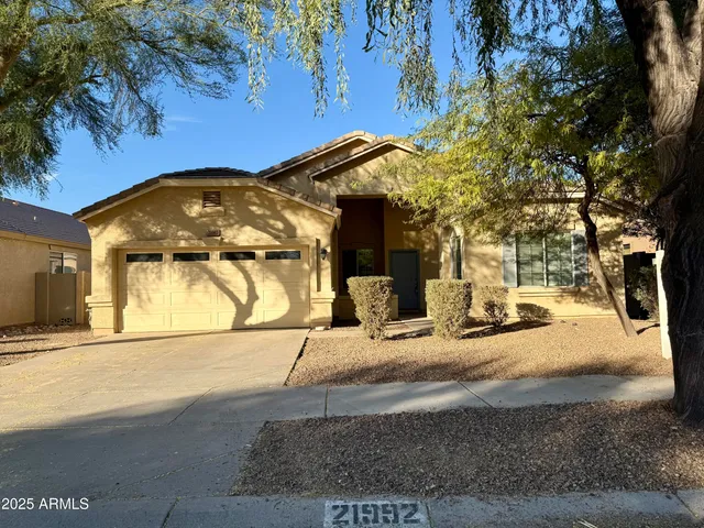 a view of a house with a snow on the road
