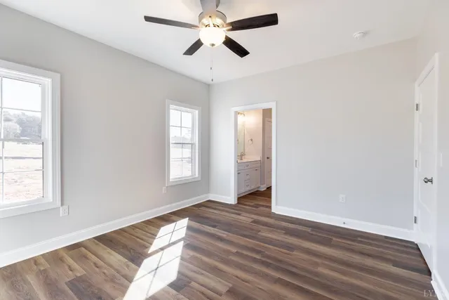 a a bathroom view of a toilet and a mirror