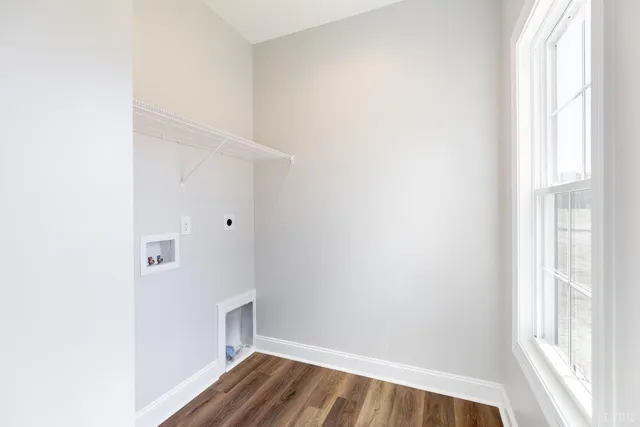 a front view of a house with yard and ocean view