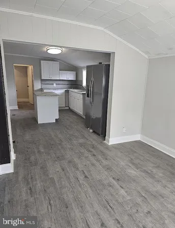 a view of kitchen with wooden floor