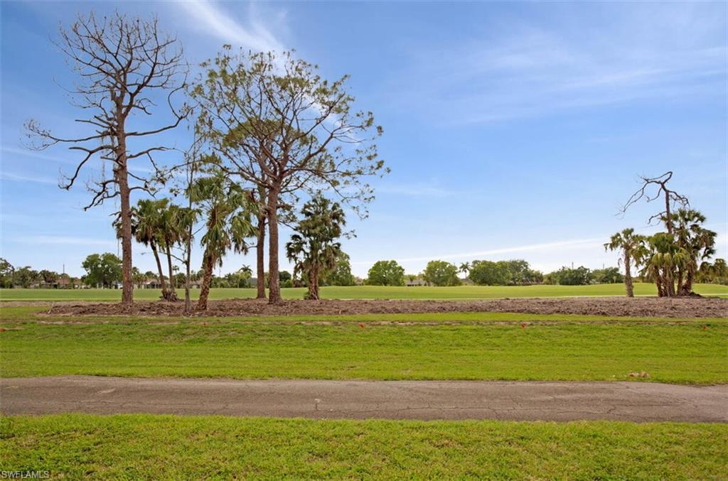 4380 27th Court Southwest, Unit 202 Naples, FL 34116 - Photo 11 of 24 a view of a big room with an ocean and trees