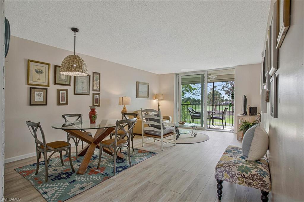 4380 27th Court Southwest, Unit 202 Naples, FL 34116 - Photo 20 of 24 a living room with furniture and a window