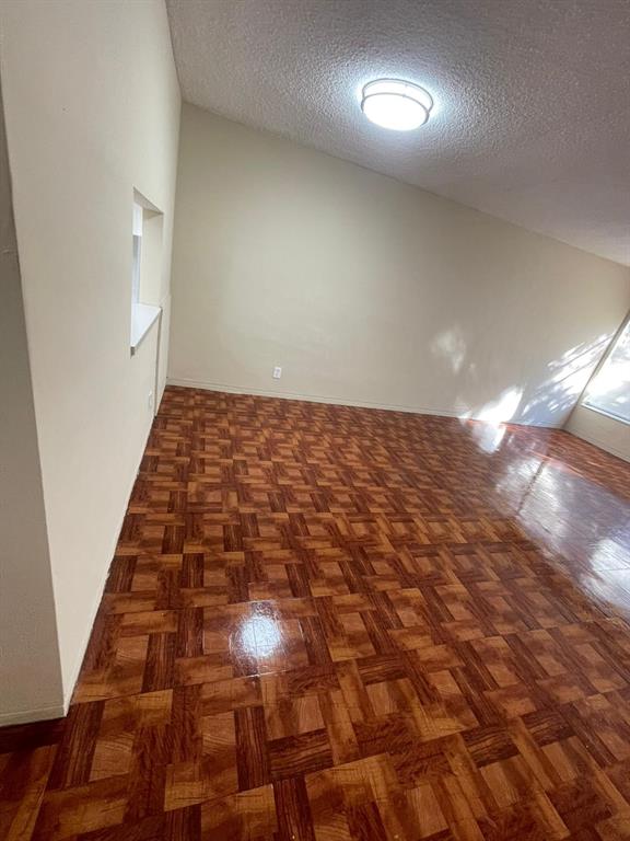 16800 Northeast 15th Avenue, Unit 310 North Miami Beach, FL 33162 - Photo 11 of 23 an empty room with wooden floor