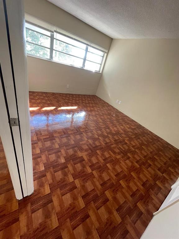 16800 Northeast 15th Avenue, Unit 310 North Miami Beach, FL 33162 - Photo 12 of 23 an empty room with windows