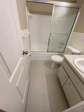 a view of water heater room with wooden floor