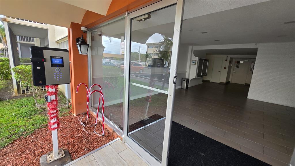 16800 Northeast 15th Avenue, Unit 310 North Miami Beach, FL 33162 - Photo 19 of 23 a view of water heater room with wooden floor