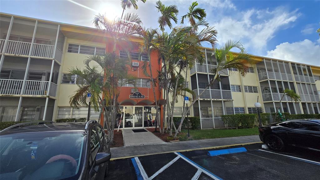 16800 Northeast 15th Avenue, Unit 310 North Miami Beach, FL 33162 - Photo 23 of 23 a front view of a building with a garden