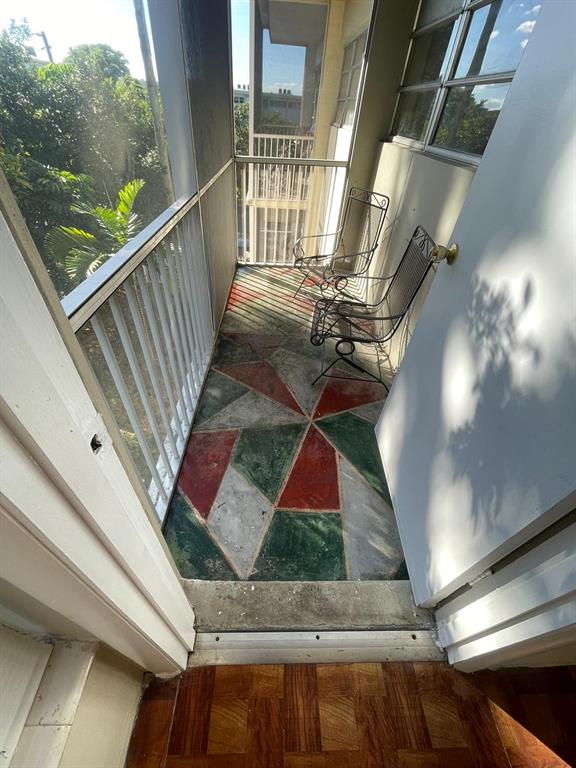 16800 Northeast 15th Avenue, Unit 310 North Miami Beach, FL 33162 - Photo 8 of 23 a view of a balcony with staircase