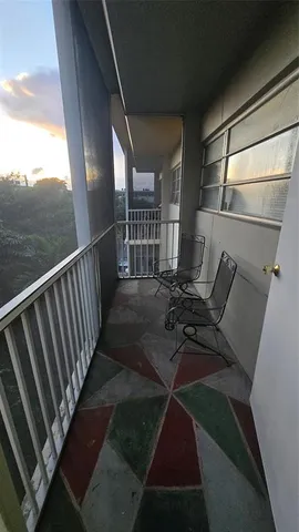 an empty room with wooden floor