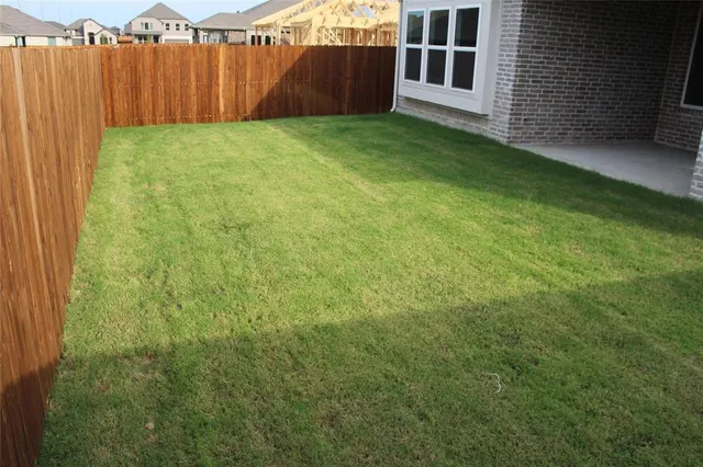 a view of a backyard with a garden
