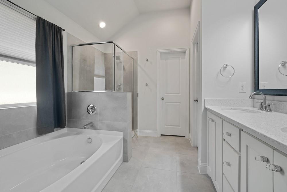 511 Ranchwood Drive Justin, TX 76247 - Photo 15 of 31 Primary bathroom with dual sinks, separate tub and shower, and walk in closet
