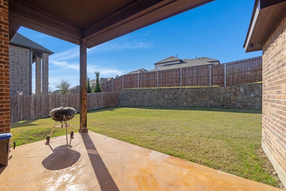 511 Ranchwood Drive Justin, TX 76247 - Photo 20 of 31 Covered patio with large backyard