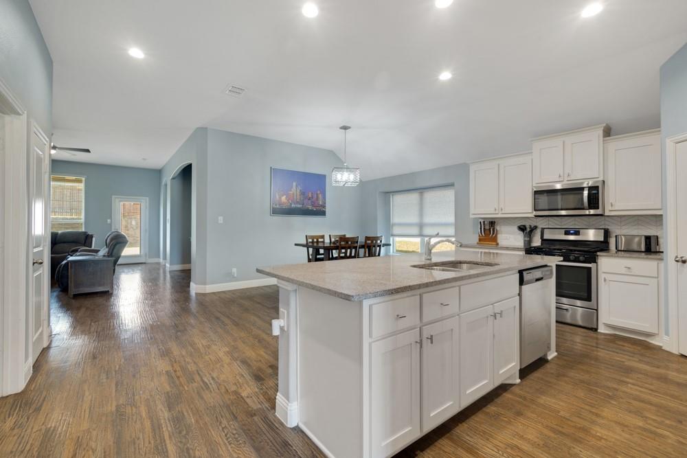 511 Ranchwood Drive Justin, TX 76247 - Photo 31 of 31 Open floor plan kitchen and living area