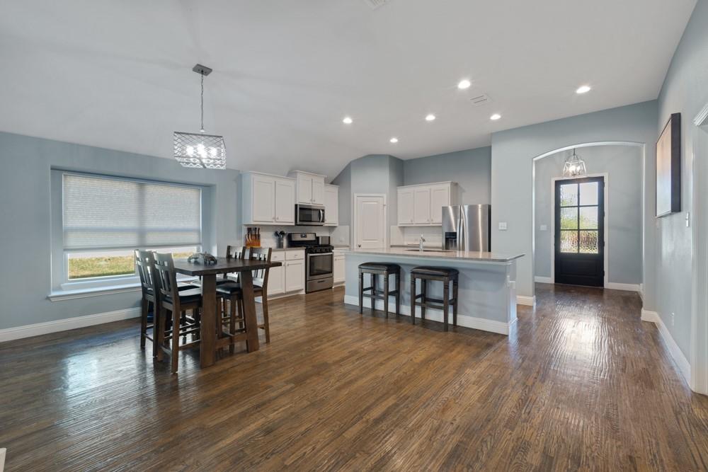 511 Ranchwood Drive Justin, TX 76247 - Photo 7 of 31 Dining area and breakfast bar