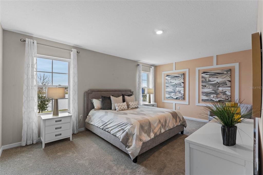 1816 Three Bars Road Kissimmee, FL 34744 - Photo 13 of 59 a bedroom with a bed and a potted plant