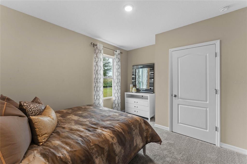 1816 Three Bars Road Kissimmee, FL 34744 - Photo 26 of 59 a bedroom with a bed and a window