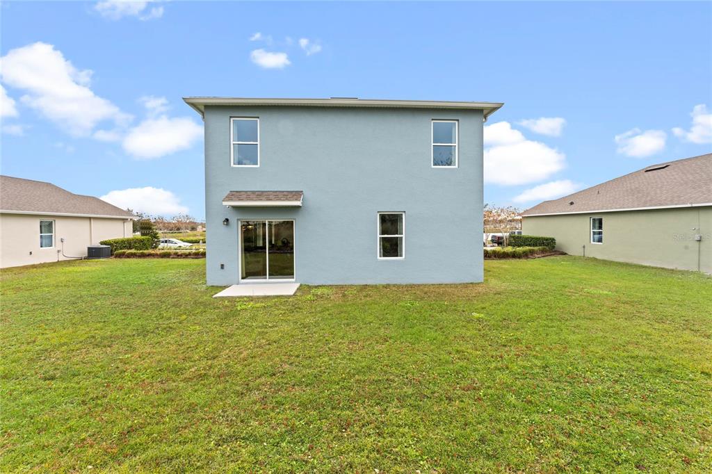 1816 Three Bars Road Kissimmee, FL 34744 - Photo 28 of 59 a view of a house with a yard