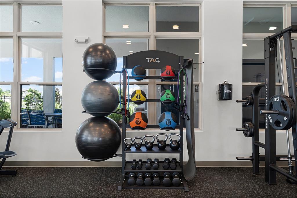 1816 Three Bars Road Kissimmee, FL 34744 - Photo 32 of 59 a kitchen with a stove and a wooden floor