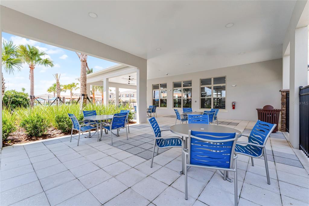 1816 Three Bars Road Kissimmee, FL 34744 - Photo 40 of 59 a view of a dining room with chairs and table in a patio