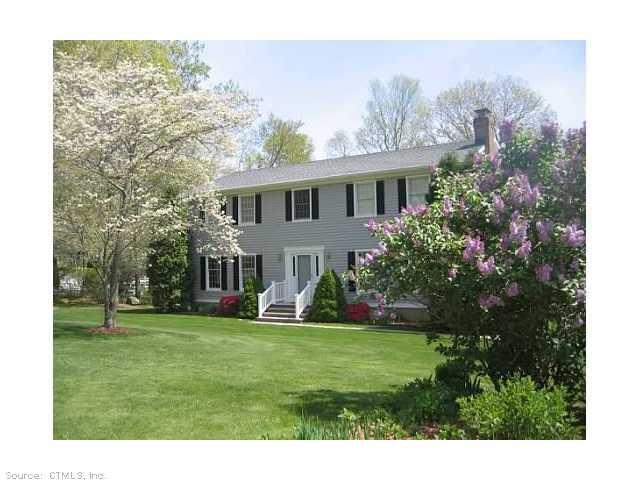 10 Spring Rock Road East Lyme, CT 06333 - Photo 1 of 1 a front view of house with yard and green space