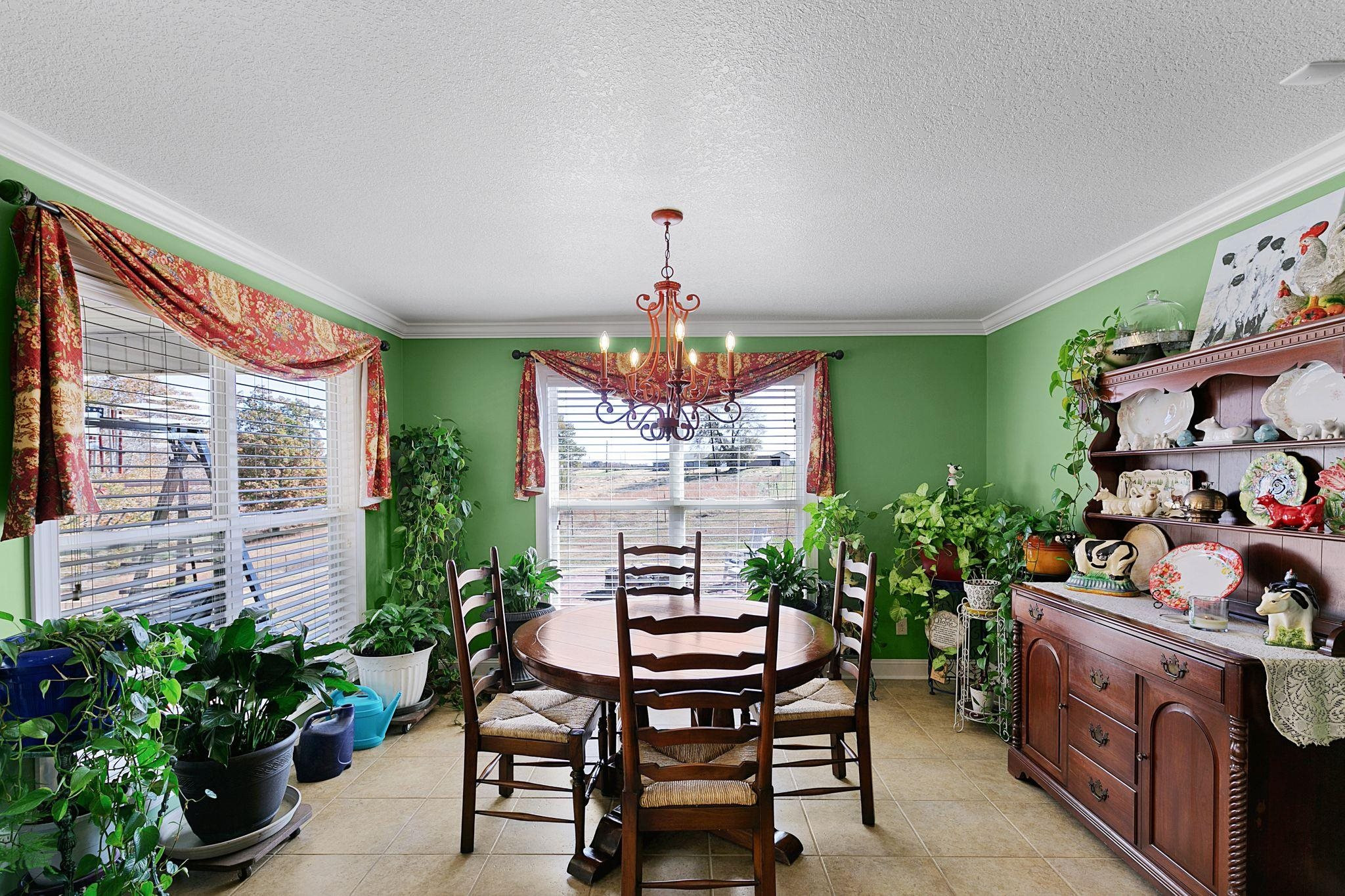 1982 Hammlett Road Beech Bluff, TN 38313 - Photo 6 of 26 a view of a dining room with furniture and a potted plant