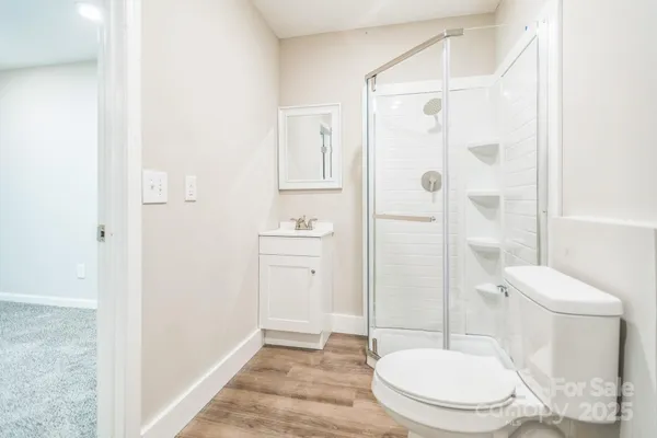 a white toilet sitting next to a bathroom sink