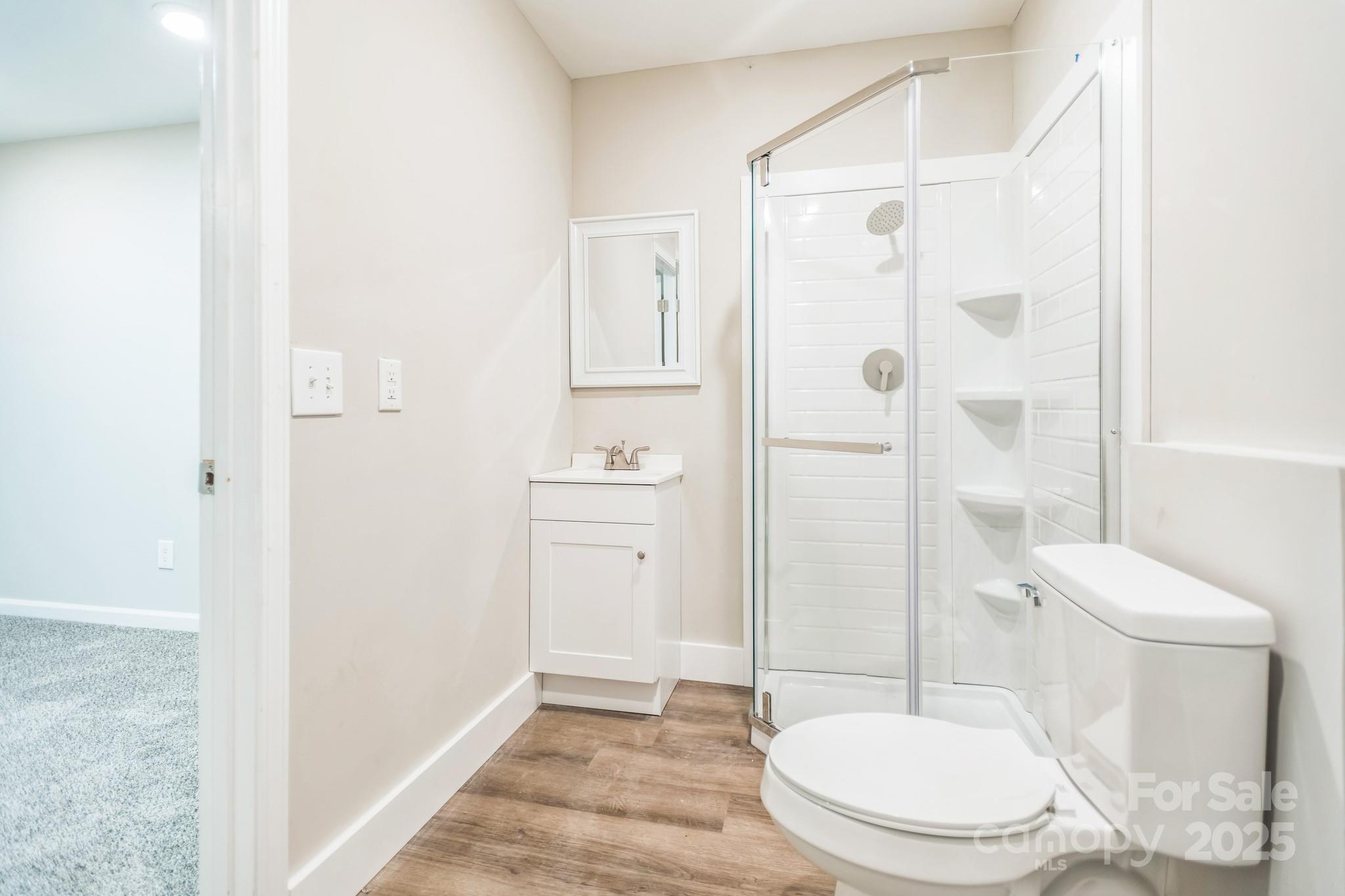 240 Doe Run Morganton, NC 28655 - Photo 11 of 15 a white toilet sitting next to a bathroom sink