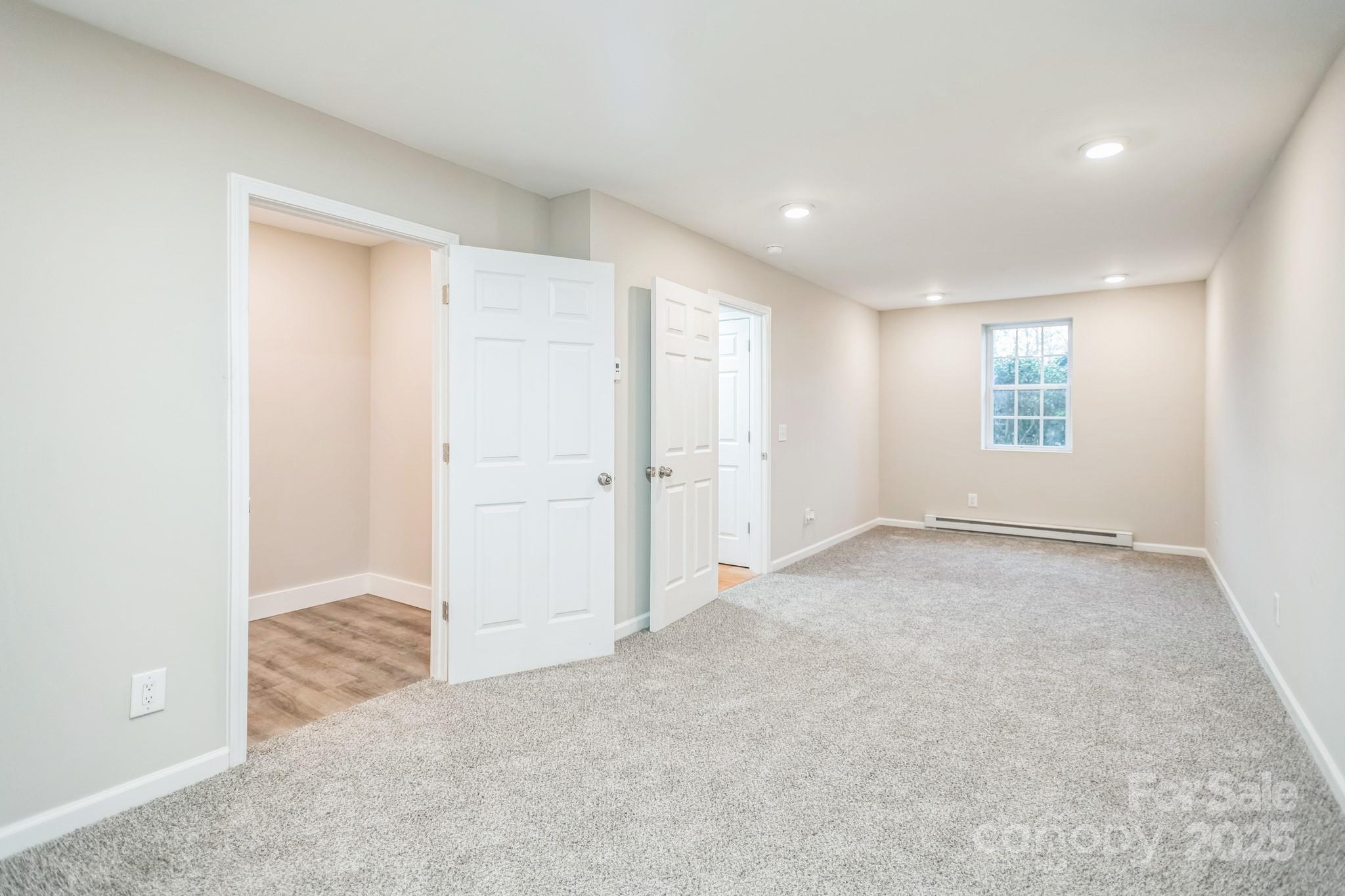 240 Doe Run Morganton, NC 28655 - Photo 14 of 15 an empty room with windows and closet