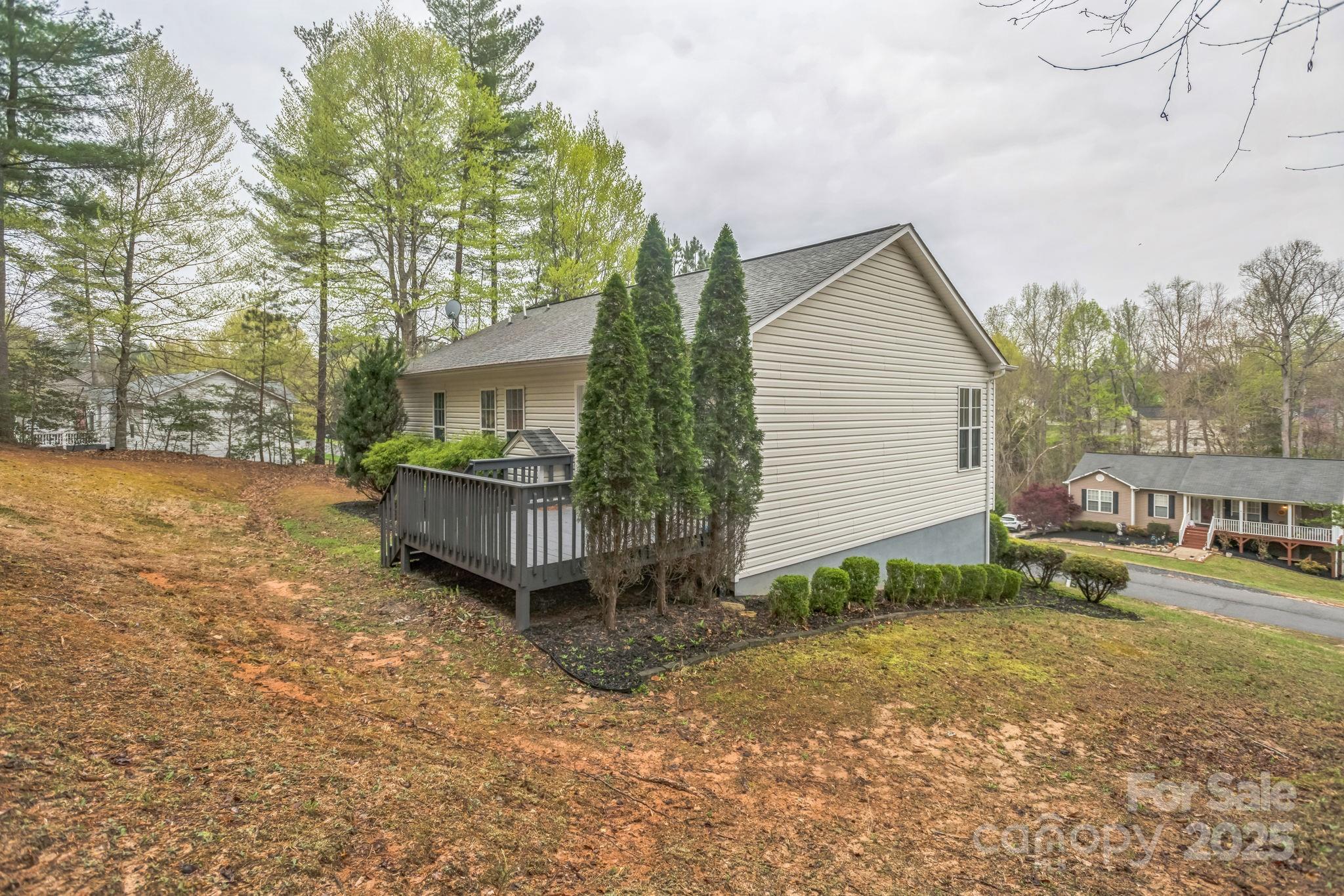 240 Doe Run Morganton, NC 28655 - Photo 6 of 15 a view of a house with backyard and trees