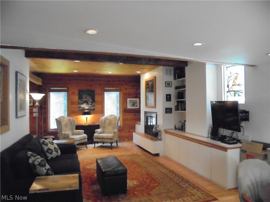 25014 Lake Road Bay Village, OH 44140 - Photo 3 of 35 Spacious great room with gas fireplace and bookshelf built-ins.