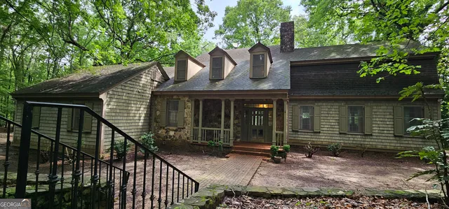 front view of a house with a tree