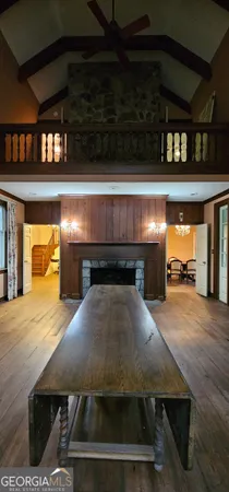 a view of a livingroom with a fireplace and window