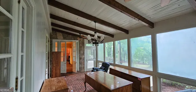 a view of an empty room and wooden floor