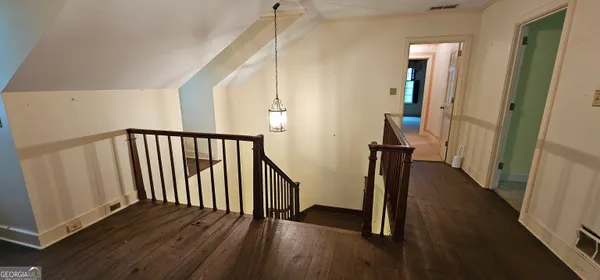 a picture of a bathroom with toilet and a shower