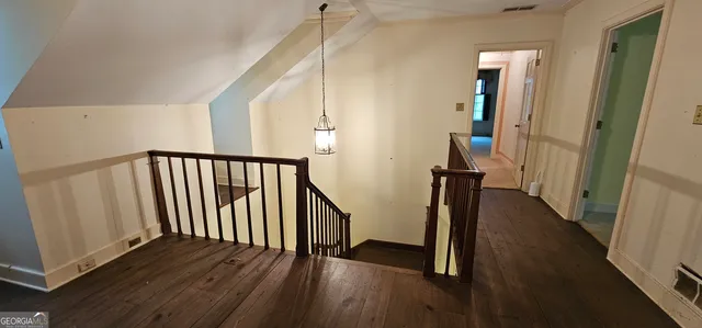 a picture of a bathroom with toilet and a shower